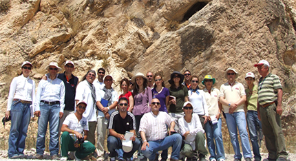 group photo in front of rock formation